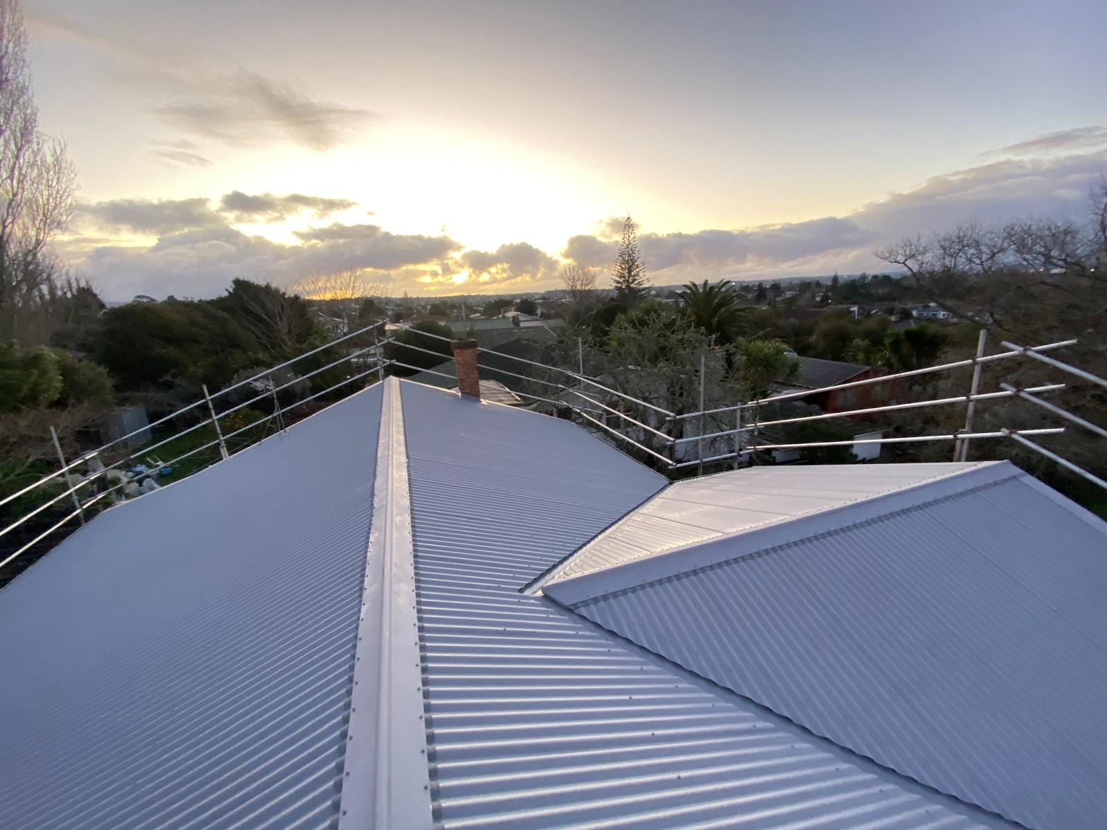 Completed residential long-run roof at sunset