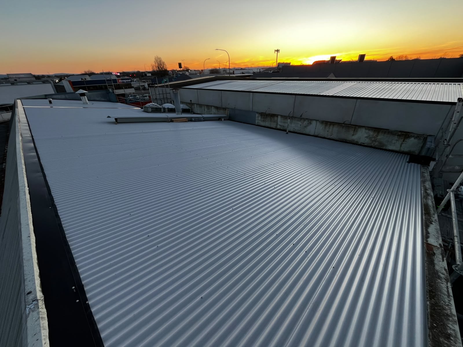 Completed long-run roof at sunset