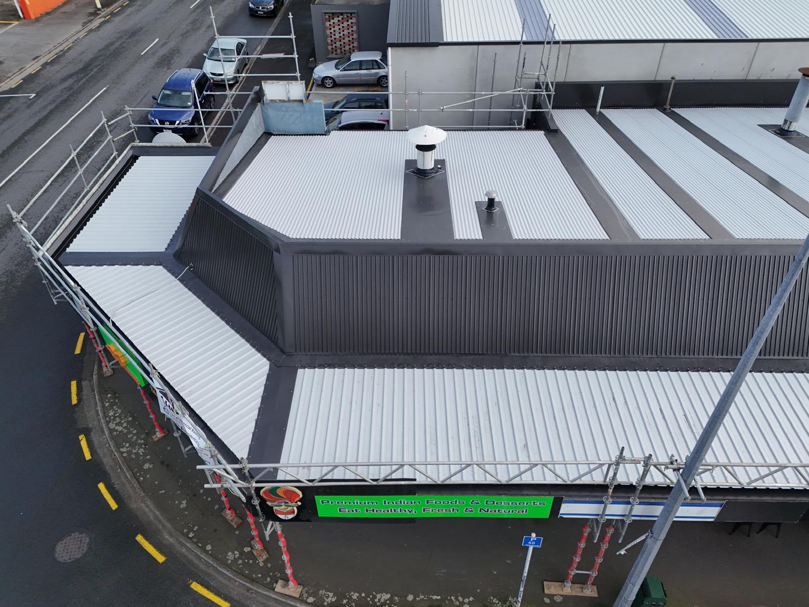 Corner parapet detailing on a completed commercial re-roof