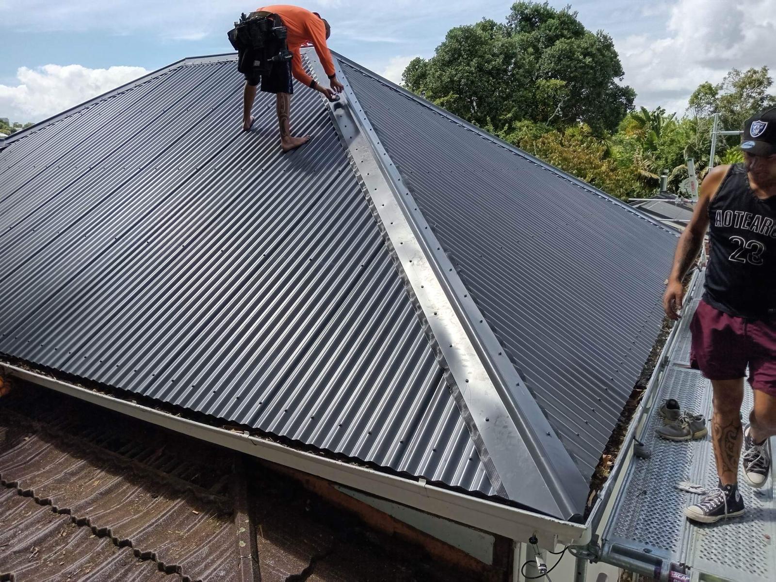 Installing dark corrugate roofing on a residential roof
