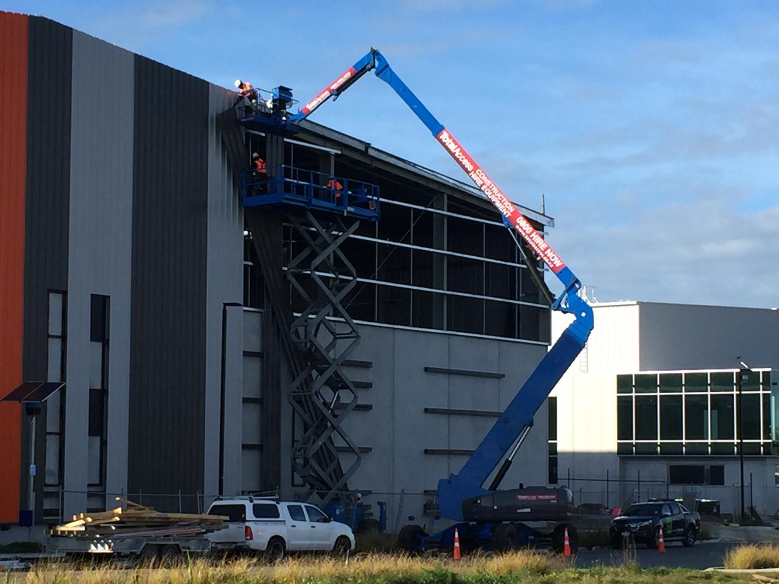 Steel wall cladding installed at height on a commercial building