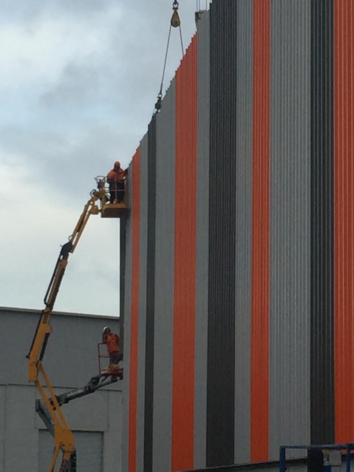 Multi-colour steel wall cladding on a commercial elevation